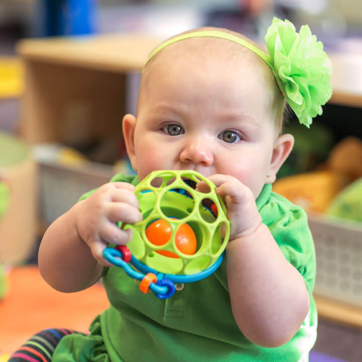 Infant playing with ball Infants & Toddlers