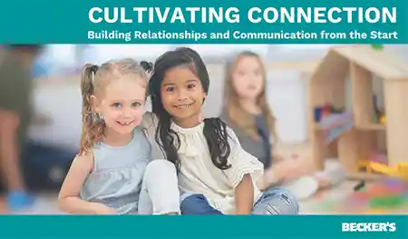 Preschool children sitting on carpet in classroom